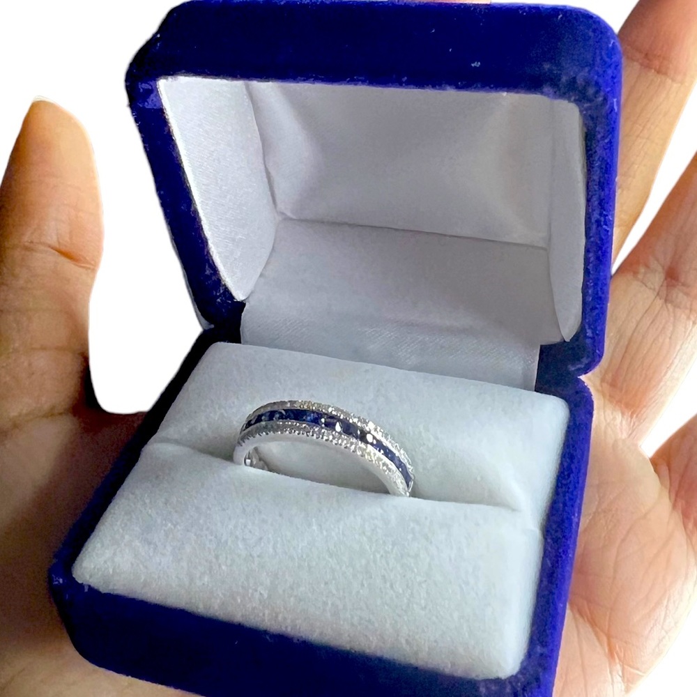 14kw ring surrounded by blue sapphire & diamonds size 7.5